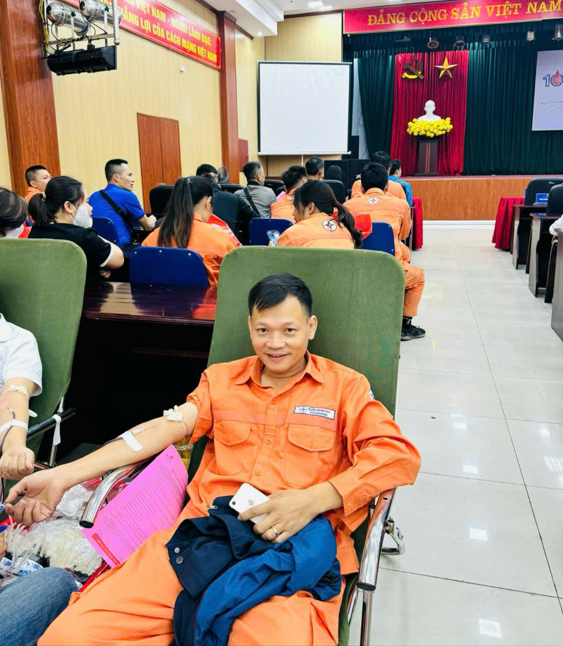 A person in orange jumpsuit sitting in a chair in a room with peopleAI-generated content may be incorrect.